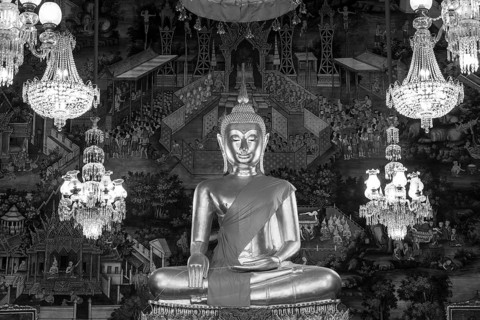 Golden Buddha statue, Phra Buddha Trilokachet surrounded by crystal chandeliers and exquisite wall