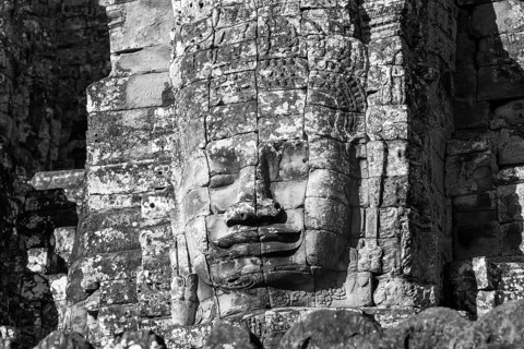 Huge stone-carved face of Bodhisattva Lokeshvara, also Avalokiteshvara, Bayon Temple, Angkor Thom,