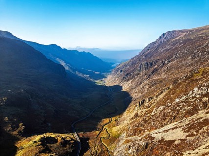 Autumn colours of Pen-y-Pass over Miner's Track, Start Point and road A4086 from a drone,