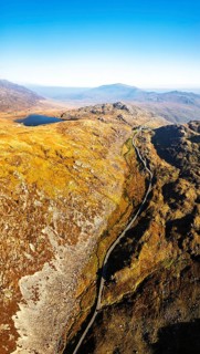 Autumn colours over Llyn Cwmffynnon and Miner's Track, Start Point, road A4086 from a drone,