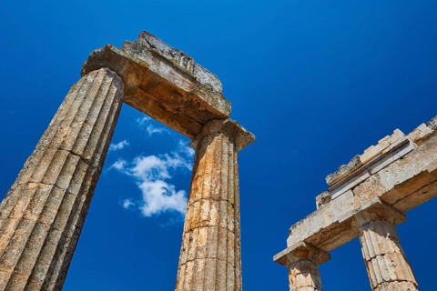 Ancient columns rising into the clear sky, Nemea, Ancient Zeus Church, Archaeological Site,