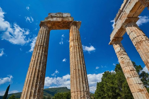 Single ancient column and ruins with clear sky, Nemea, Ancient Zeus Heightum, Archaeological Site,