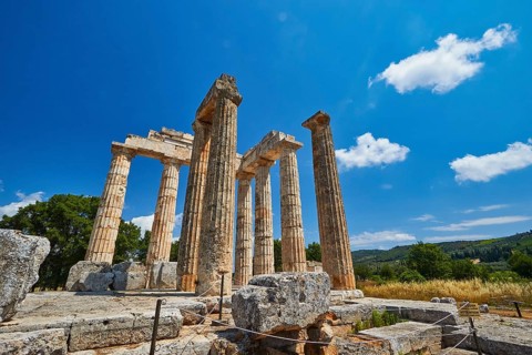 Ancient columns in a vast landscape under clear sky, Nemea, Ancient Zeus Heightum, Archaeological