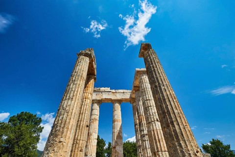 Pillars of an ancient ruin against a blue sky, Nemea, Ancient Zeus Heightum, Archaeological Site,