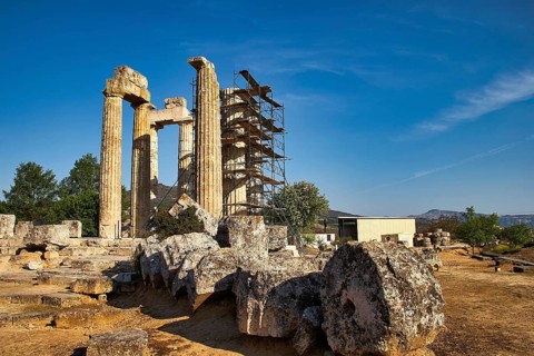 Ancient columns with landscape in the background. Ruins and Nature, Nemea, Ancient Temple of Zeus,