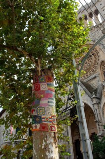Decorated tree trunk, behind Església de Sant Bartomeu de Sóller, Soller, Majorca, Spain