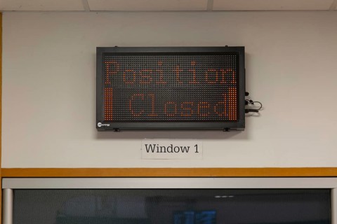 Position Closed sign at railway ticket office, Exeter St Davids railway station, Exeter, Devon,