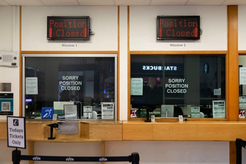 Position Closed signs at railway ticket office, Exeter St Davids railway station, Exeter, Devon,
