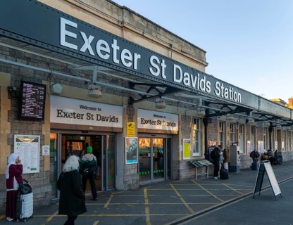 Sign and entrance to Exeter St Davids railway train station, Exeter, Devon, England, UK