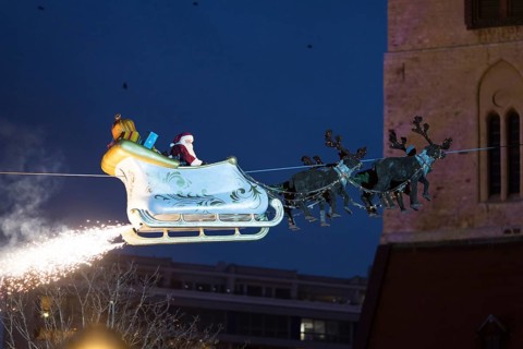 Santa Claus floats in a carriage at the opening of the Berlin Christmas market on Alexanderplatz,