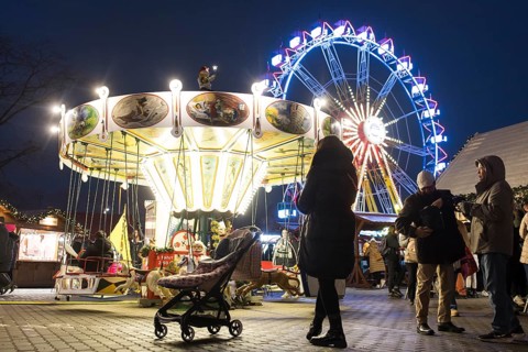 Children's carousel and Ferris wheel at the Berlin Christmas market on Alexanderplatz, Berlin, 24