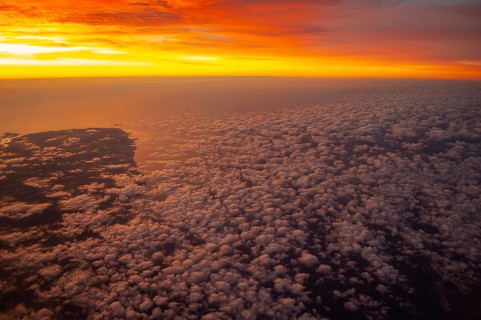 View from airplane window at sunrise