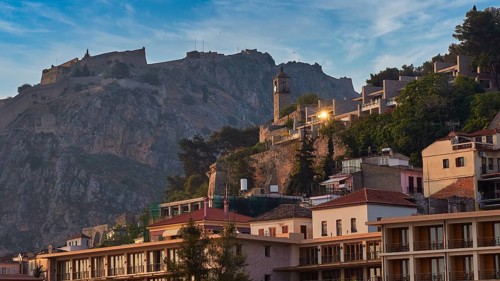 Palamidi fortress, town with a castle on a hill in the morning light, surrounded by old buildings