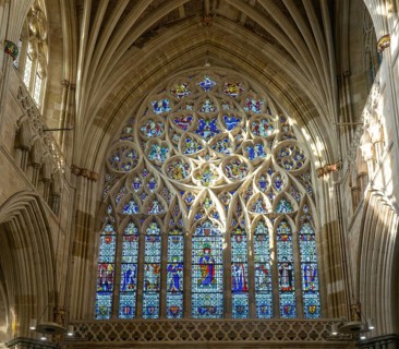 Stained glass of the west window inside Exeter cathedral church, Exeter, Devon, England, UK