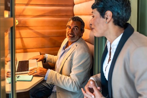 Business colleagues having a relaxed discussion and working together in a cozy, soundproofed