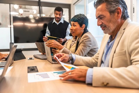 Business colleagues of diverse ages and ethnicities collaborating during an important meeting,