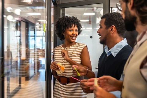 Diverse business people collaborating during an agile meeting, discussing creative concepts and