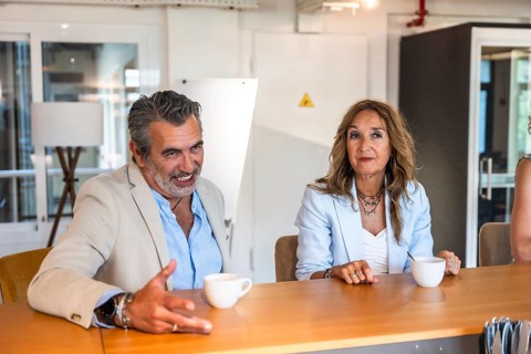 Diverse business colleagues engaging in a discussion and creative conversation during an informal