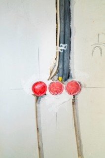 Three sockets built into the wall, new cable installation during renovation