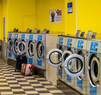 Washing machines in a public laundromat, Frankfurt am Main, Hesse, Germany
