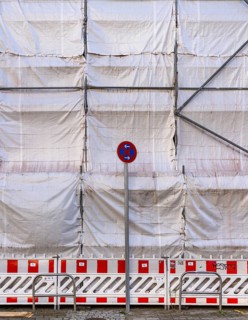 White construction plans cover the entire construction site of a building, Ziegelstraße, Berlin,