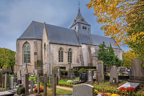 12th century Church of Our Lady, Onze-Lieve-Vrouwekerk in the village Wulveringem in autumn, fall,