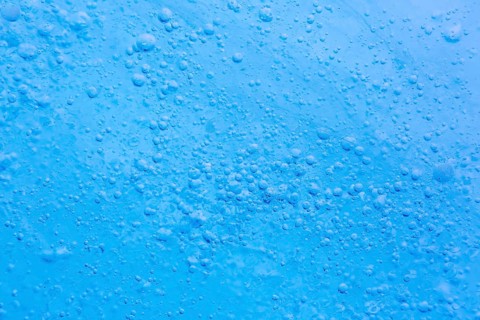 Close-up of air bubbles trapped within glacial ice at Mohnbukta, bay at Storfjorden in Sabine Land