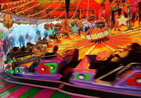 People on the Musik-Express ride at the All Saints Fair, the biggest old town fair in Europe,