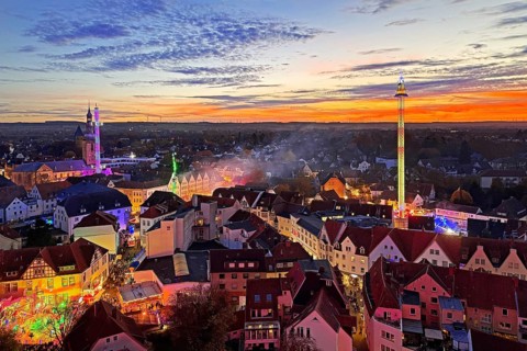 View from above from the Ferris wheel of the atmospheric All Saints Fair in the evening, Altstadt,