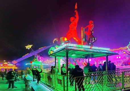 Colourfully illuminated All Saints Fair at night, the largest old town fair in Europe, Soest, North
