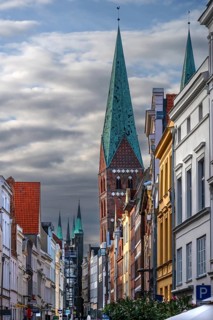 Shopping street with historic houses and the towers of St. Mary's Church, Hanseatic City of Lübeck,
