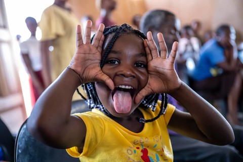 Young girl making grimaces, locals, Caprivi strips, Namibia