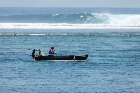 Fishing outrigger boat off Sanur beach, Bali, Indonesia