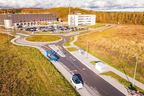 Modern architecture with street, parking lot and surrounding autumn landscape, new Lindenrain