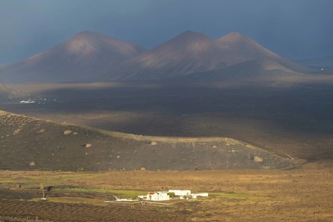 Finca in the La Geria wine-growing region, behind the Timanfaya National Par with the Fire