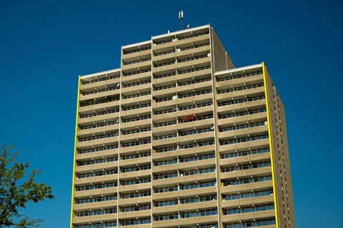 High-rise apartment building with balconies and satellite dishes, satellite town of Chorweiler in