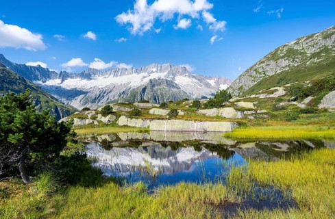Picturesque mountain landscape, dammastock and damma glaciers reflected in Moorsee, Göscheneralp,