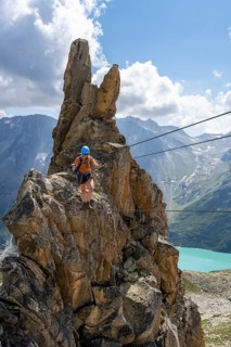 Crocodile rock formation, mountaineer on rope bridge in the Crocodile Mountain Lake via ferrata on