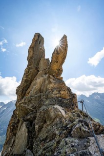 Crocodile rock formation with sun star, via ferrata Krokodil-Bergsee am Bergseeschijen-Vorbau,