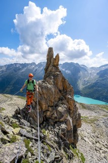 Crocodile rock formation, mountaineer on rope bridge in the Crocodile Mountain Lake via ferrata on