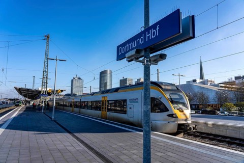 The skyline of the city center of Dortmund as seen from the main train station, Eurobahn train,