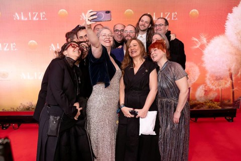 Guests take a group photo at the Cirque du Soleil Alizé world premiere at the Berliner Theater am