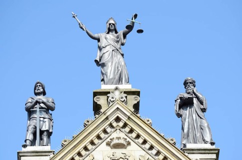 The figures Power, Justice and Wisdom on the town hall in Odense, Fyn, Funen island, Denmark,