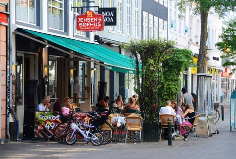 People in street restaurant in Odense, Fyn island, Funen, Denmark, Scandinavia