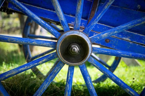 Blue-painted spokes of a wooden cart, Maihaugen open-air museum with houses and objects from farms