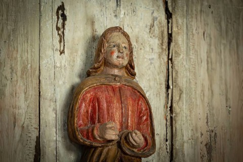 Carved wooden figure with red cape, Garmo Stave Church, Maihaugen open-air museum with houses and