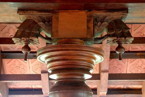 Decorative wood structure with carved details on a ceiling, traditional architectural style, Kalari
