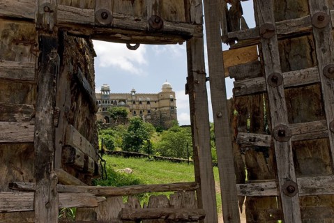 Old, heavily fortified wooden gate, Palasthotel Karni Fort Bambora entrance, Bambora, Rajasthan,