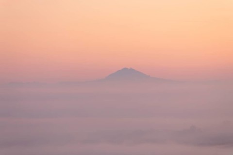 Hohenstaufen mountain in golden morning light, Aichelberg. Spectacular dawn over the foggy