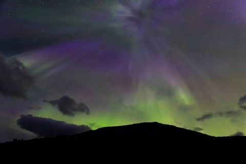 Northern lights at dawn at Sørfolda Fjord near Kjerringøy between Bodø and Sørfold in Norway